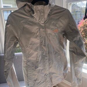 The North Face Gray Windbreaker Jacket with Hood and Water-Resistant Material